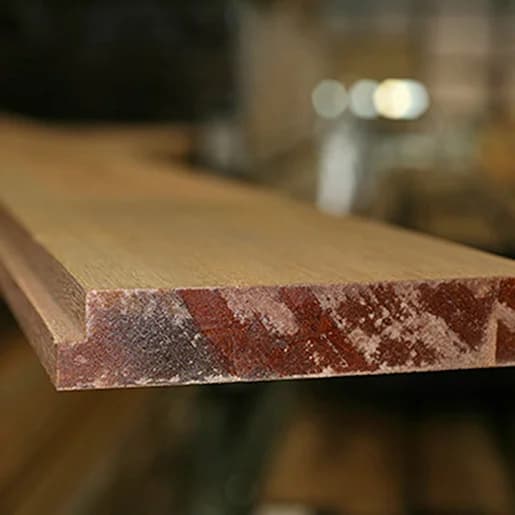 Apitong shiplap boards stacked at the warehouse, banded for shipment