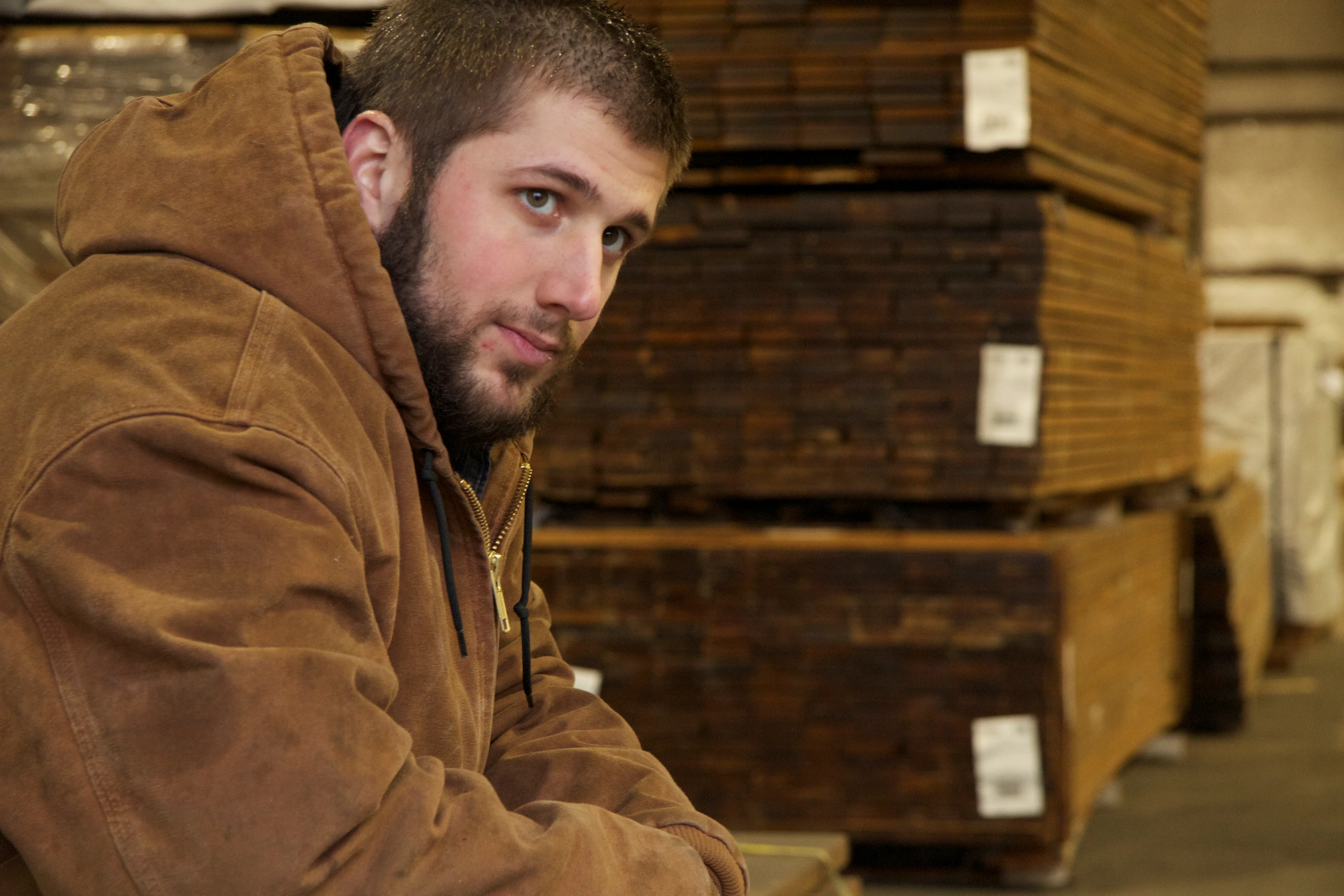 Warehouse worker moving lumber units